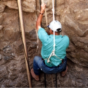 MF Makki descending into a water well by rope