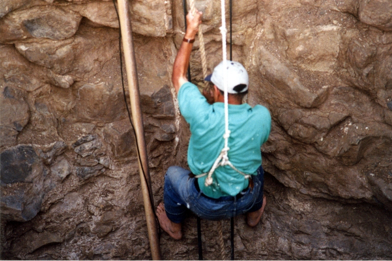 MF Makki descending into a water well by rope