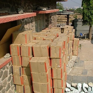 Cardboard boxes stacked, waiting to be shrink wrapped and palletized
